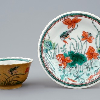 A Chinese famille verte and café au lait cup and saucer, Kangxi